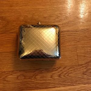 Metallic gold hard shell clutch